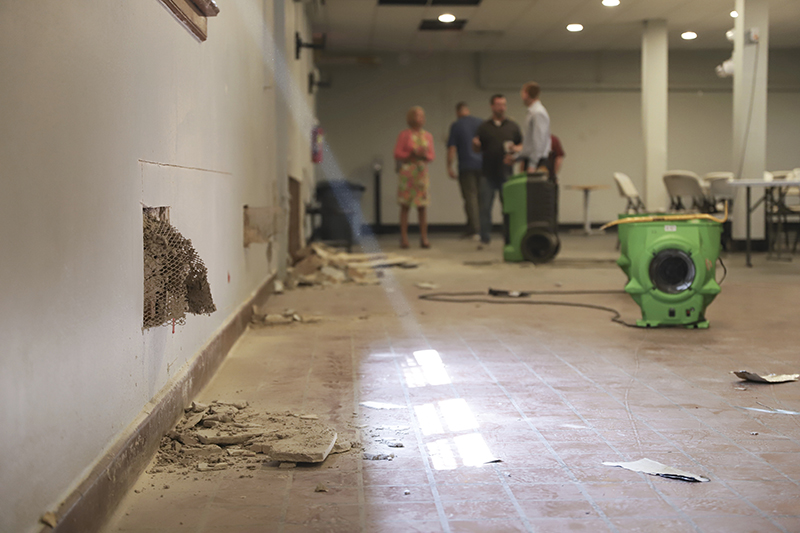 photo of a religious organization's property damage with the client and Glatfelter Ministry Care claims representatives standing in the background